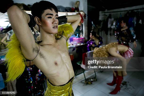 chiang-mai-thailand-ashi-a-ladyboy-dancer-looks-in-the-mirror-after-getting-into-costume.jpg