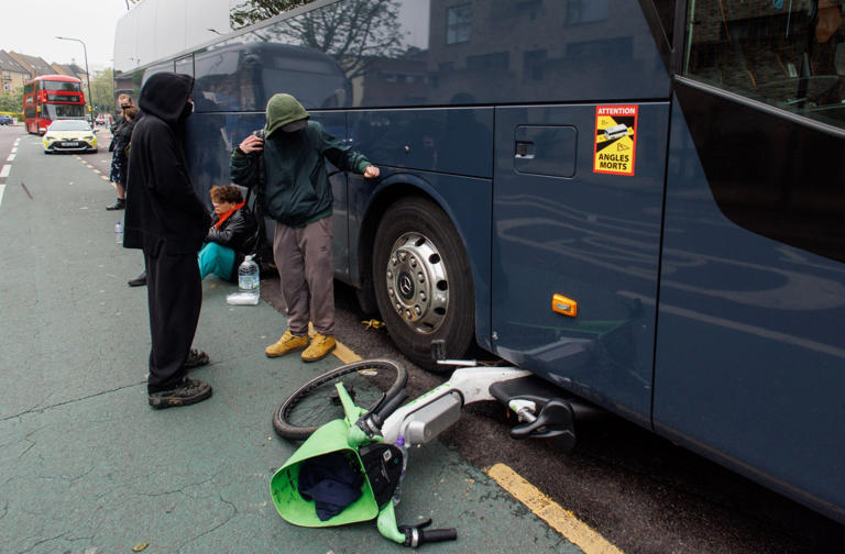 Lime Bikes were used to stop the bus from leaving (Picture: EPA)