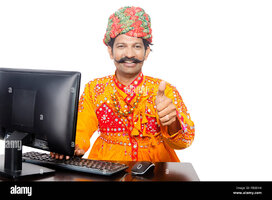 1-indian-rural-gujrati-man-computer-education-and-thumbs-up-showing-FBBEH4.jpg