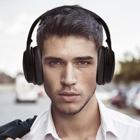 Man wearing TaoTronics Active Noise Cancelling Bluetooth Headphones