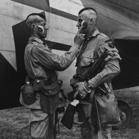 Paratrooper applies war paint 111 SC 193551cropped