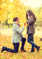 man-proposing-to-woman-autumn-park-holidays-love-couple-relationship-dating-concept-kneeled-me...jpg