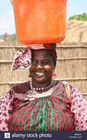 an-african-woman-carrying-a-bucket-of-water-on-her-head-mozambique-BBR6MX.jpg