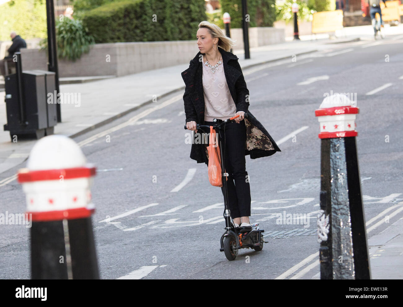 woman-commuter-on-electric-scooter-EWE13R.jpg