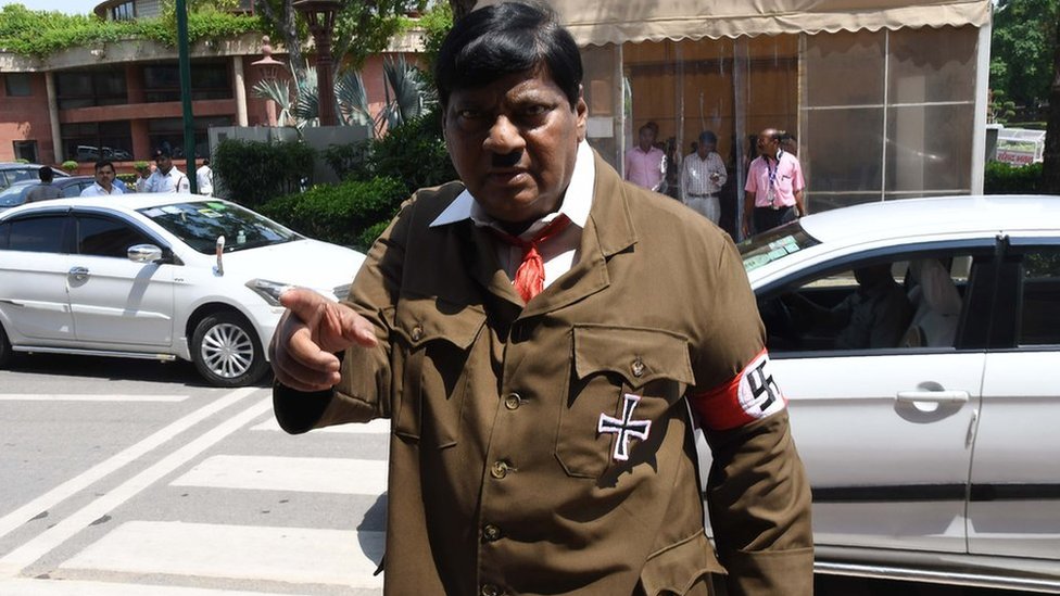 India MP shocks with Hitler costume protest in parliament