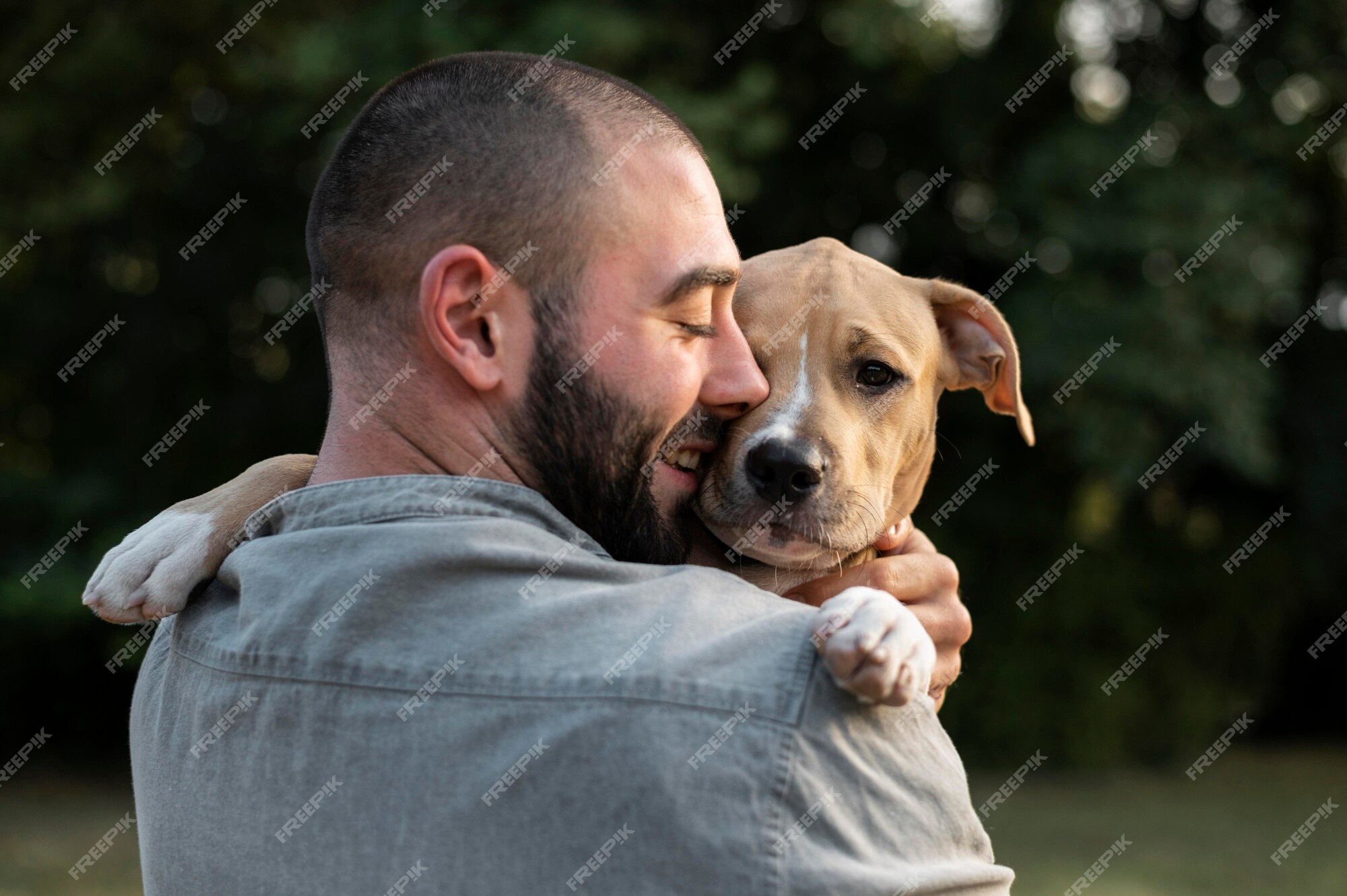 man-hugging-his-friendly-pitbull_23-2149131400.jpg