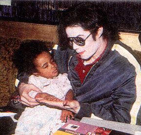 The babies always go to sleep in Michael's loving arms… | Michael jackson,  Michael jackson photoshoot, Micheal jackson