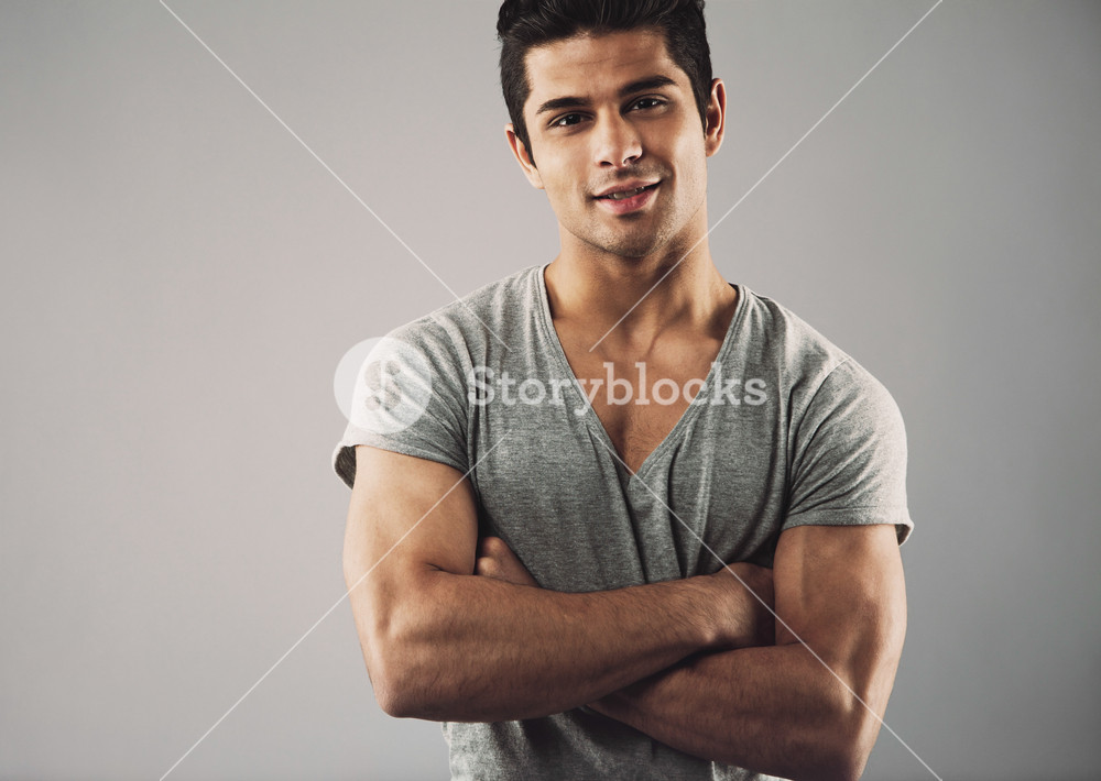 cropped-image-of-muscular-young-man-standing-with-his-arms-crossed-against-grey-background-macho-man-posing-confidently_rT-gdvUVYe_SB_PM.jpg