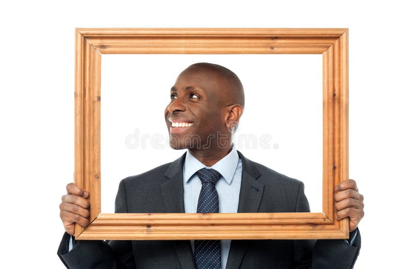 man-holding-wooden-picture-frame-smiling-guy-looking-away-40849433.jpg