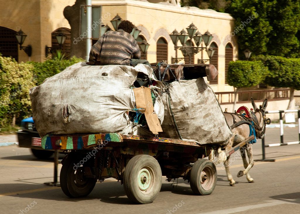 depositphotos_2825712-stock-photo-zabbaleen-trash-collectors-on-cart.jpg