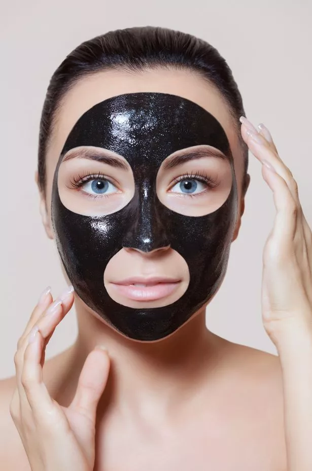 0_The-procedure-for-applying-a-black-mask-to-the-face-of-a-beautiful-woman-Spa-treatments-and-care-of.jpg