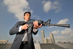 asian-chinese-man-carrying-a-high-powered-rifle-17571196.jpg