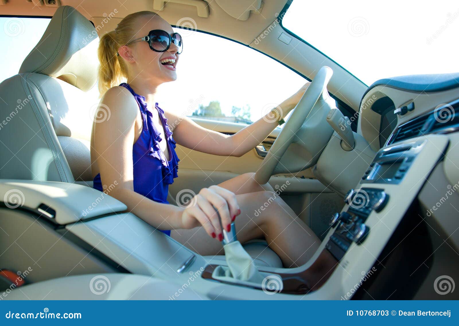 blonde-woman-driving-10768703.jpg