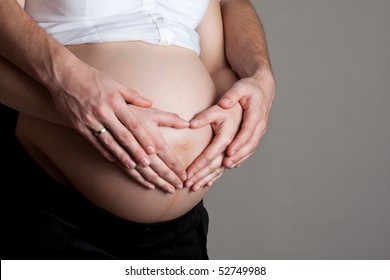 advanced-pregnant-belly-hands-260nw-52749988.jpg