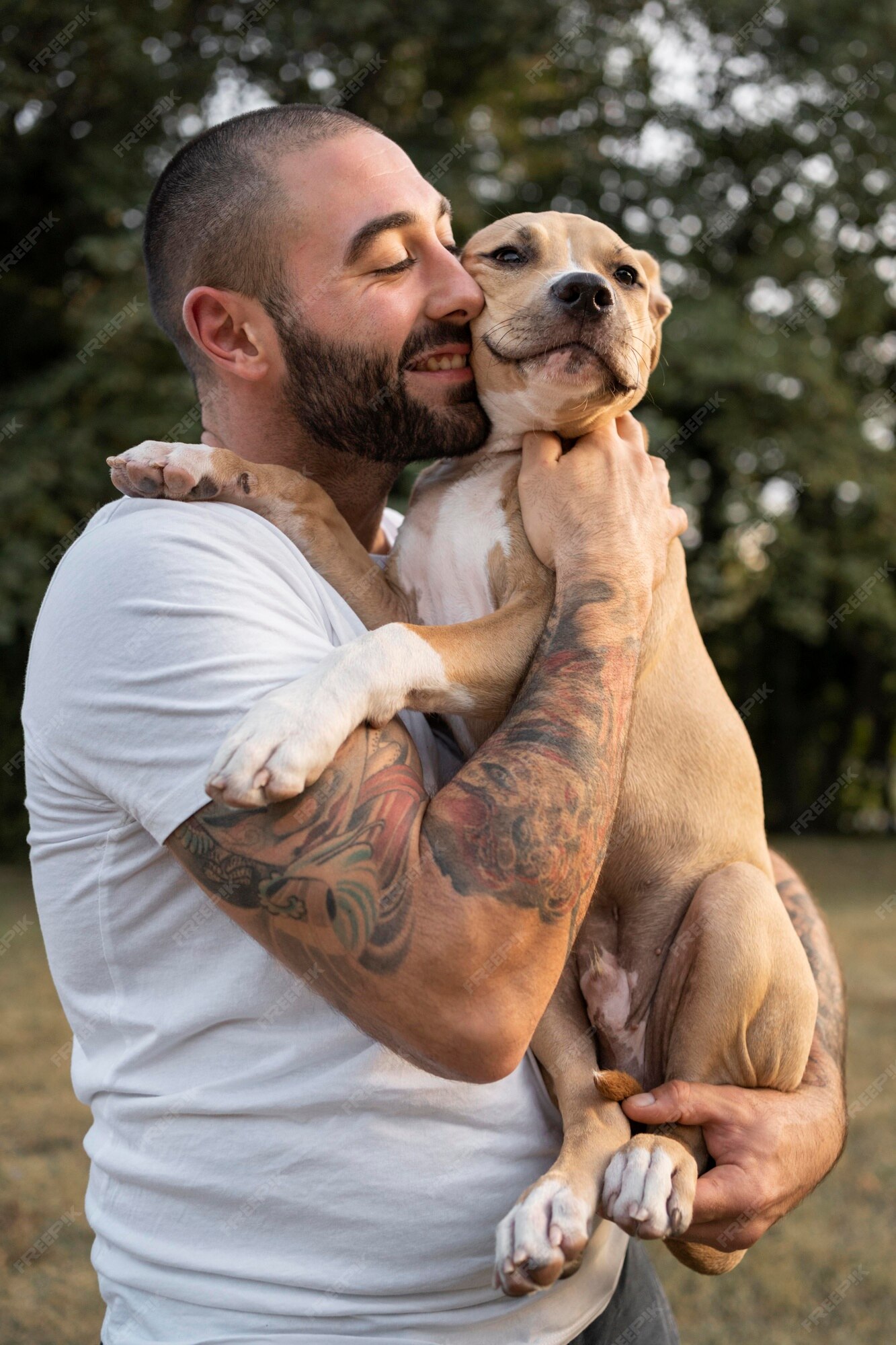 man-hugging-his-friendly-pitbull_23-2149131452.jpg