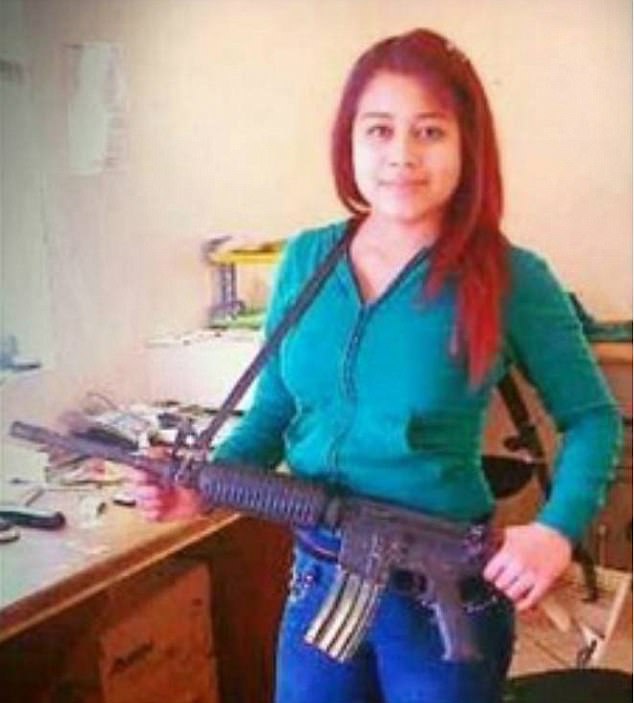  La Peque poses with a machine gun in a smiling social media post