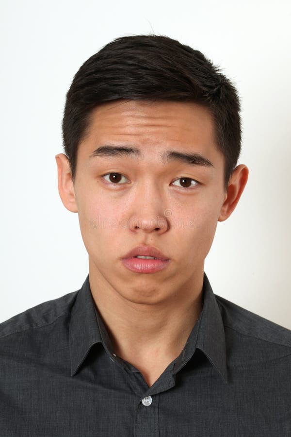 strict-young-asian-man-looking-camera-53838298.jpg