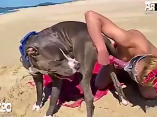 Funfunxx-blonde-woman-having-sex-with-dog-on-the-beach.jpg