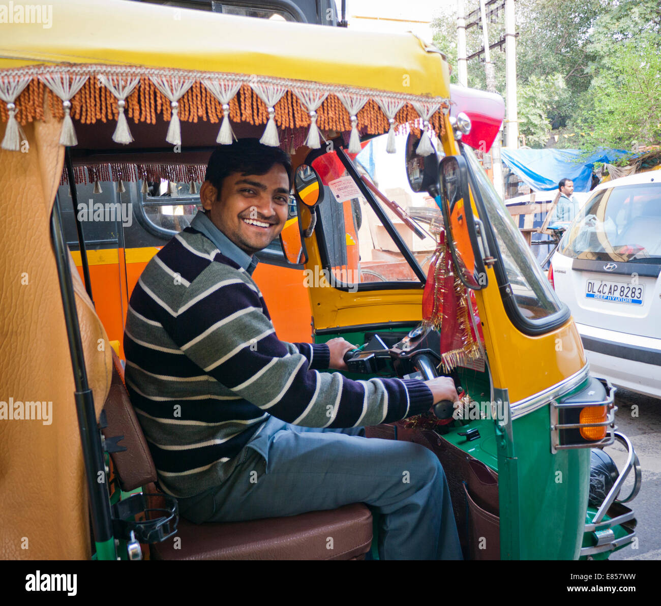 an-auto-rickshaw-driver-in-delhi-india-E857WW.jpg