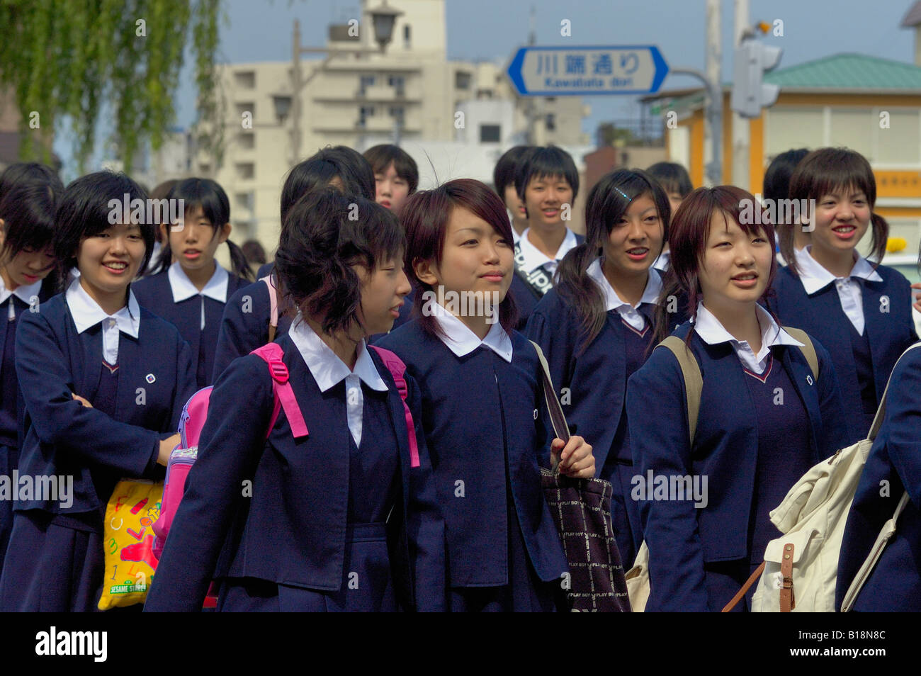 girls-at-crosswalk-in-school-uniform-kyoto-japan-B18N8C.jpg