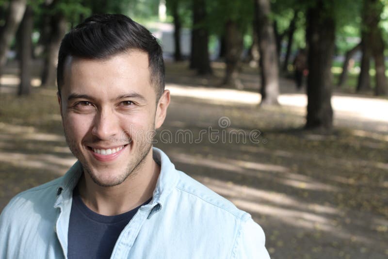 handsome-young-ethnic-man-smiling-outdoors-205190592.jpg
