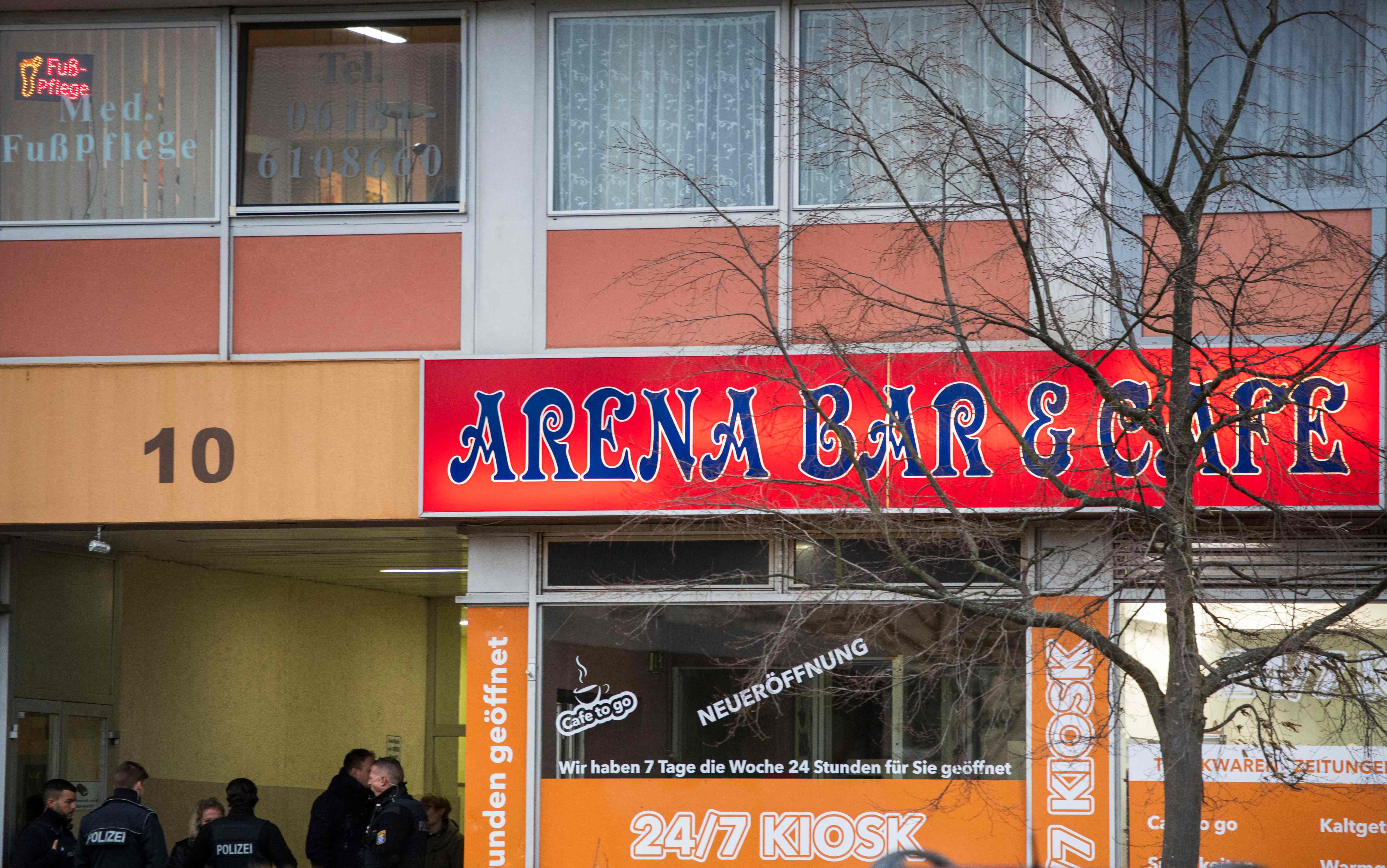 Police officers secure the Arena shisha bar in Hanau which was targeted in the shooting Police officers secure the Arena shisha bar in Hanau which was targeted in the shooting