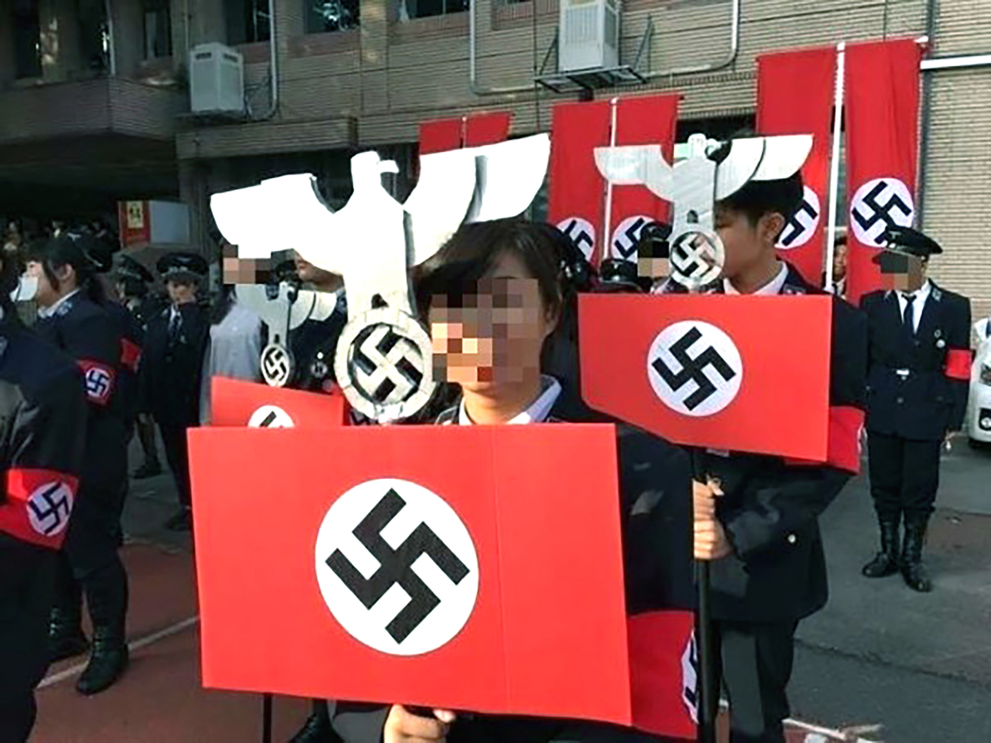 161228125511-01-taiwan-nazi-school-parade-restricted.jpg