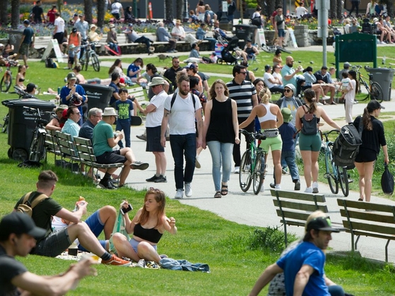 VANCOUVER, BC - May 10, 2020  - People enjoy the weather at English Bay in Vancouver, B.C., May 10, 2020. Just days after the B.C. government announced its soon-to-be implemented plans for relaxation of physical distancing guidelines, it appears many have jumped the gun and already returned to the social gatherings at parks and beaches. (Arlen Redekop / PNG staff photo) (story by reporter) [PNG Merlin Archive]