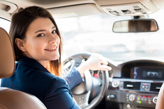 brunette-businesswoman-driving_23-2148142626.jpg