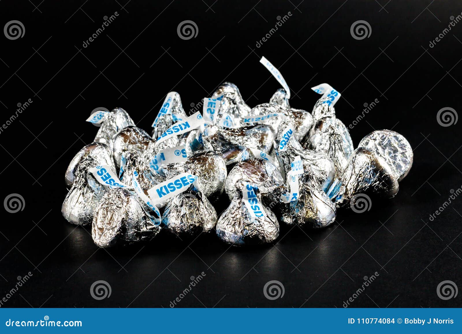 hershey-kisses-pile-hershey-kisses-pile-black-background-110774084.jpg