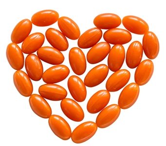CoQ10 supplement pills in the shape of a heart. CoQ10 is depleted by psychiatric drugs.