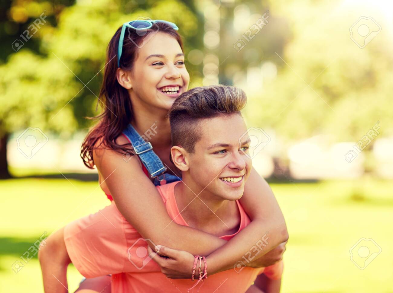 128306333-happy-teenage-couple-having-fun-at-summer-park.jpg