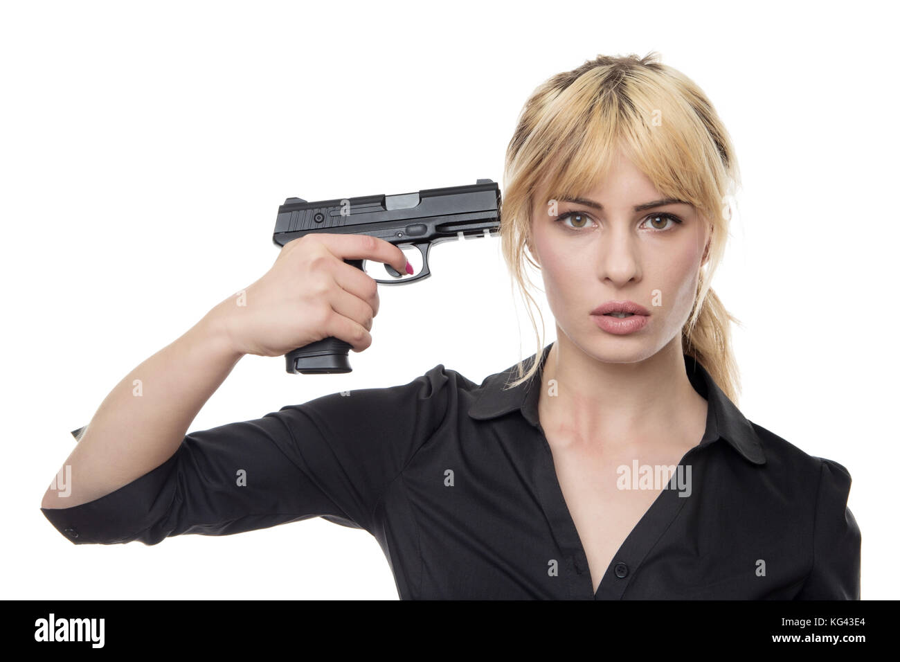 blonde-haired-business-woman-holding-a-gun-up-to-her-head-KG43E4.jpg