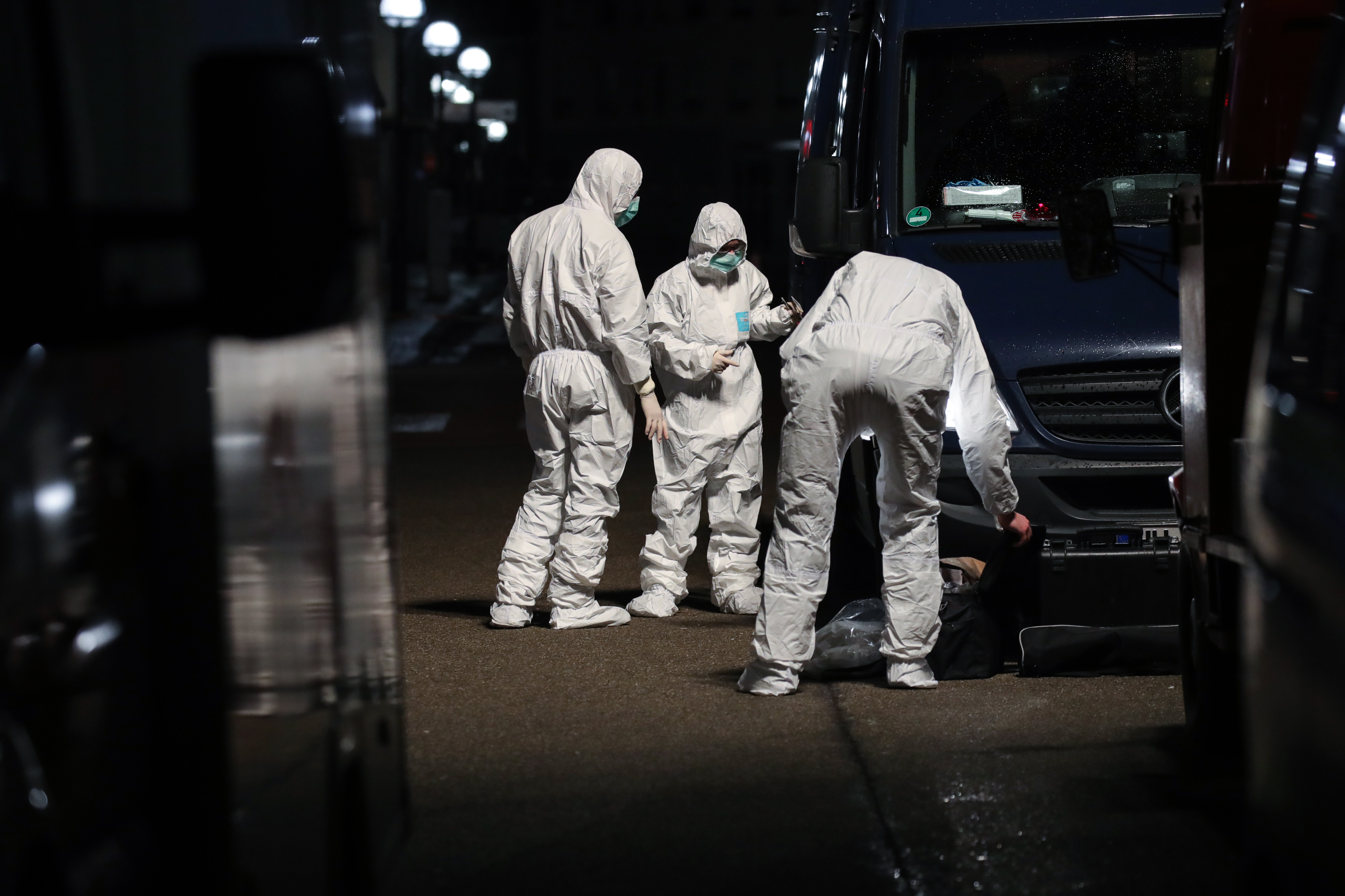 Forensic officers can be seen examining the scene Forensic officers can be seen examining the scene