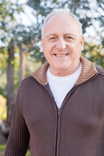 close-up-smiling-retired-man_23-2147562098.jpg