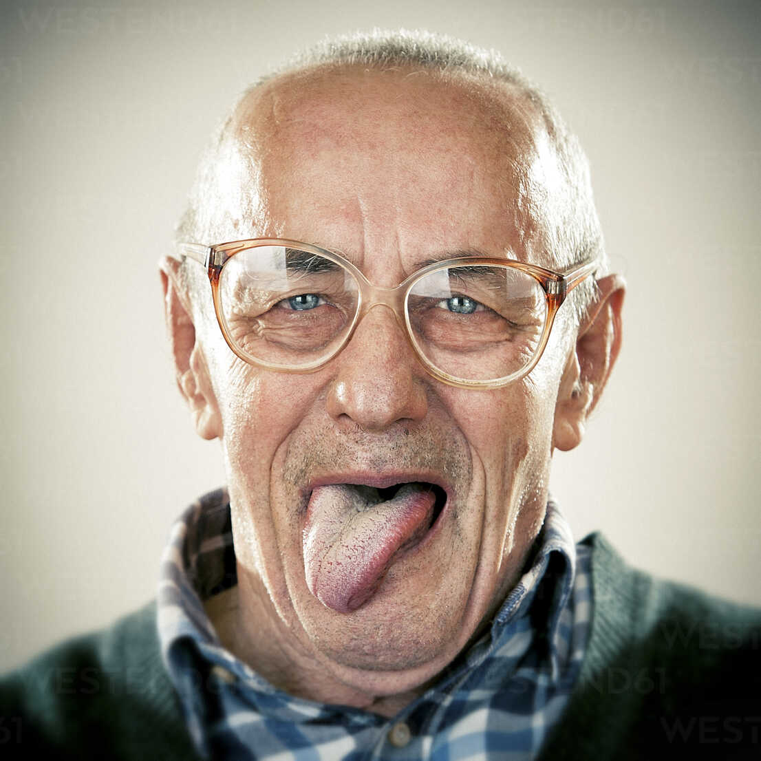 portrait-of-an-elderly-man-sticking-his-tongue-out-ZOCF00175.jpg