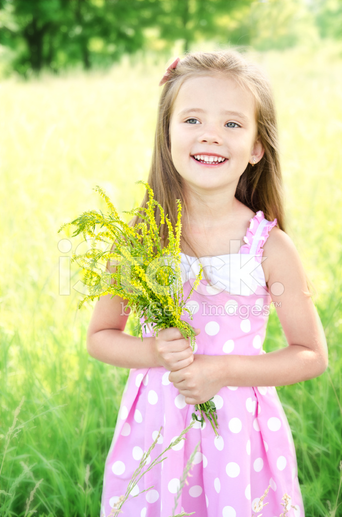 41809234-portrait-of-adorable-smiling-little-girl-with-flowers.jpg