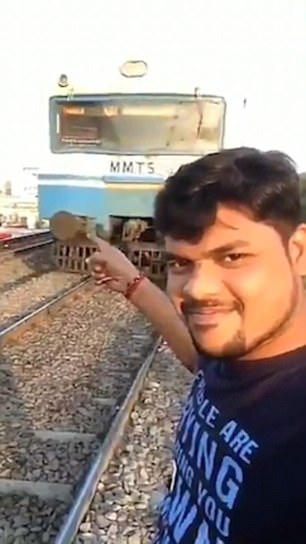 Man films himself being hit by train in India | Daily Mail Online