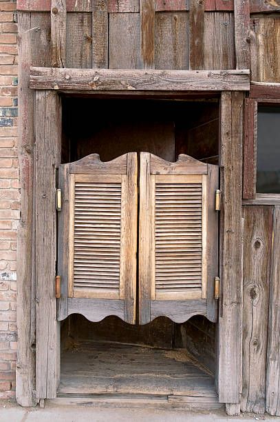 Saloon Doors Old western saloon doors. saloon doors stock pictures, royalty-free photos & images
