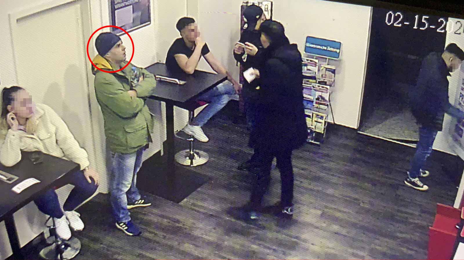 Security camera footage shows the killer (circled) visiting one of the two cafe bars he attacked Security camera footage shows the killer (circled) visiting one of the two cafe bars he attacked