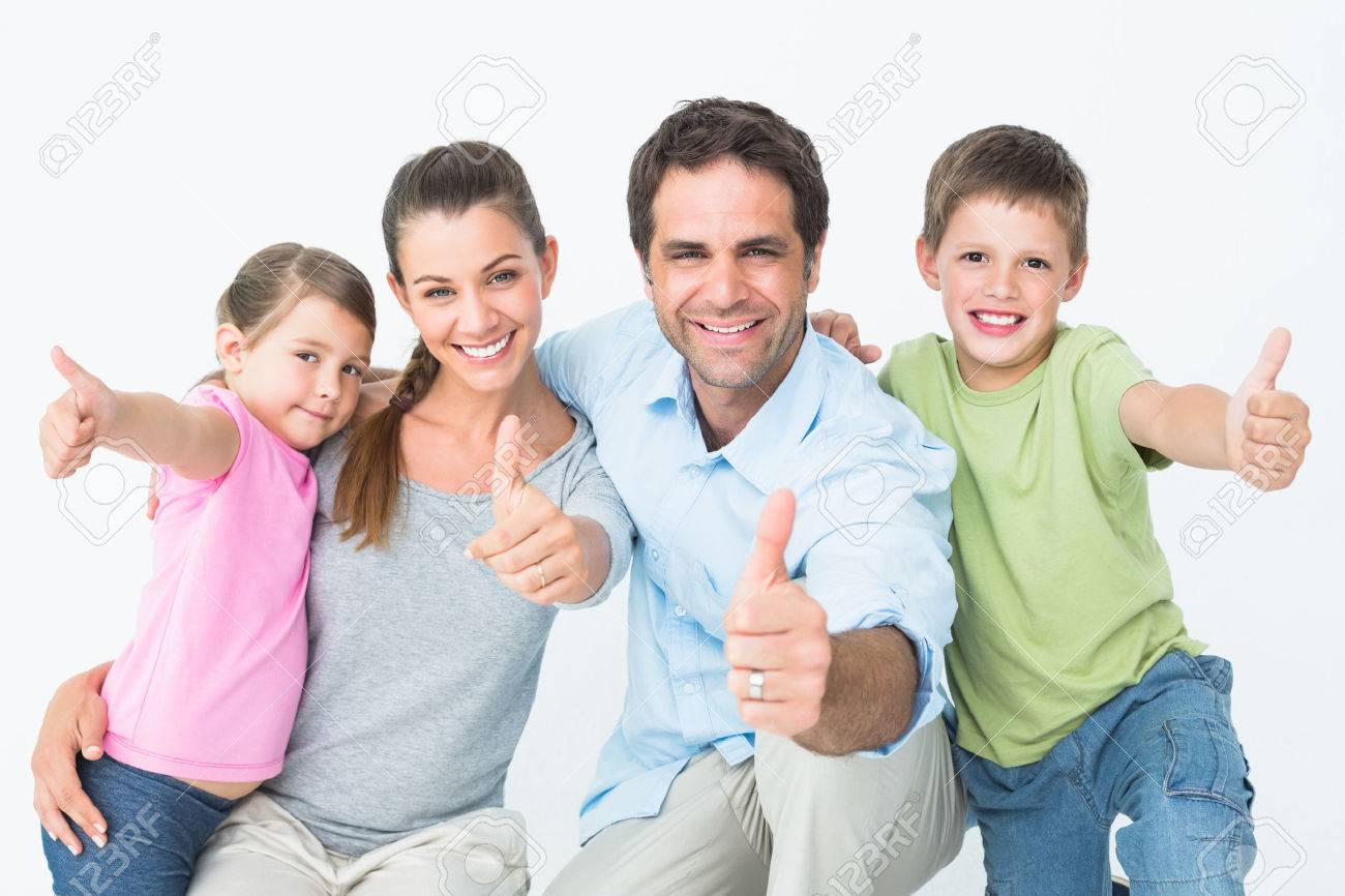 28410350-cute-family-smiling-at-camera-together-showing-thumbs-up-on-white-background.jpg