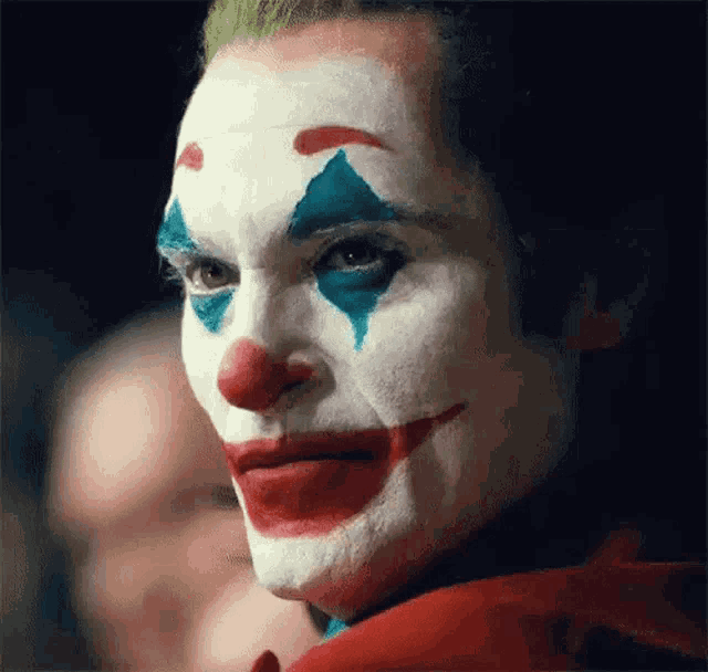 joker-teary-eyes-smiling-phottxwgnotyze1u.gif