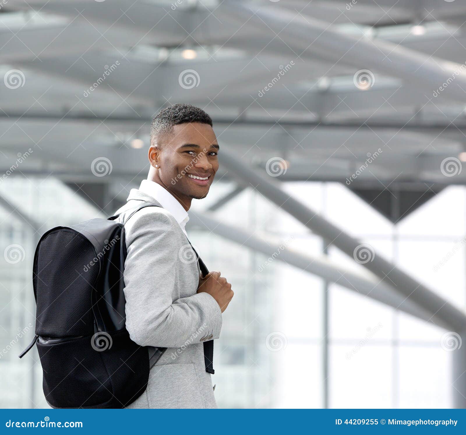 handsome-young-black-man-smiling-bag-close-up-portrait-44209255.jpg