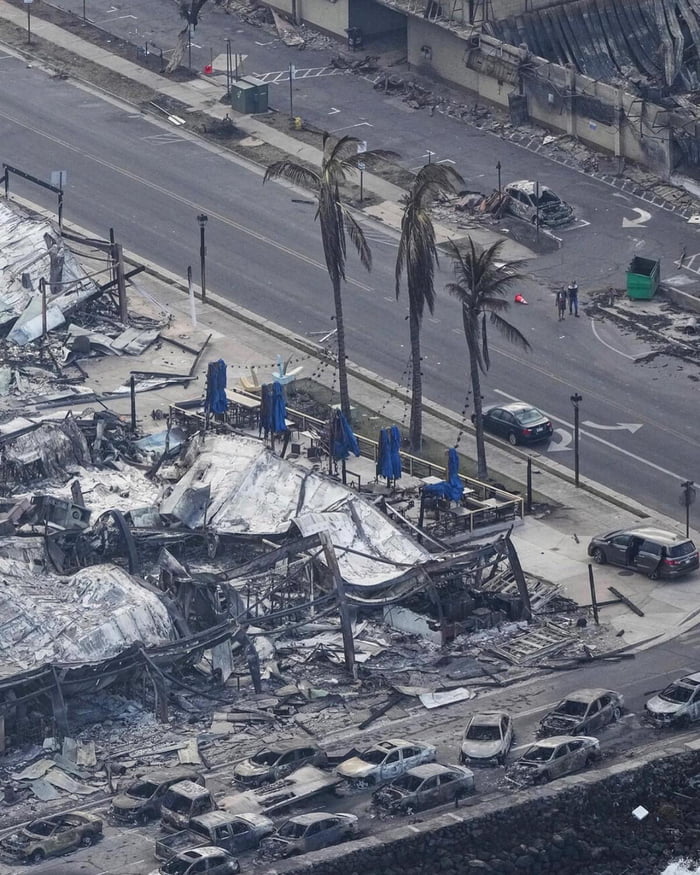 The blue umbrellas and some other blue objects (like cars) apparently were  left unharmed by the Maui fires *puts on a blue tinfoil hat* - 9GAG