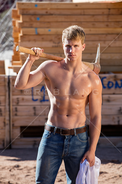 shirtless-construction-worker-with-a-pick-ax.jpg