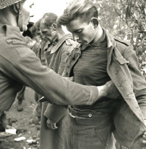 British Tommy frisks a handsome German soldier, WWII Canadian Soldiers ...