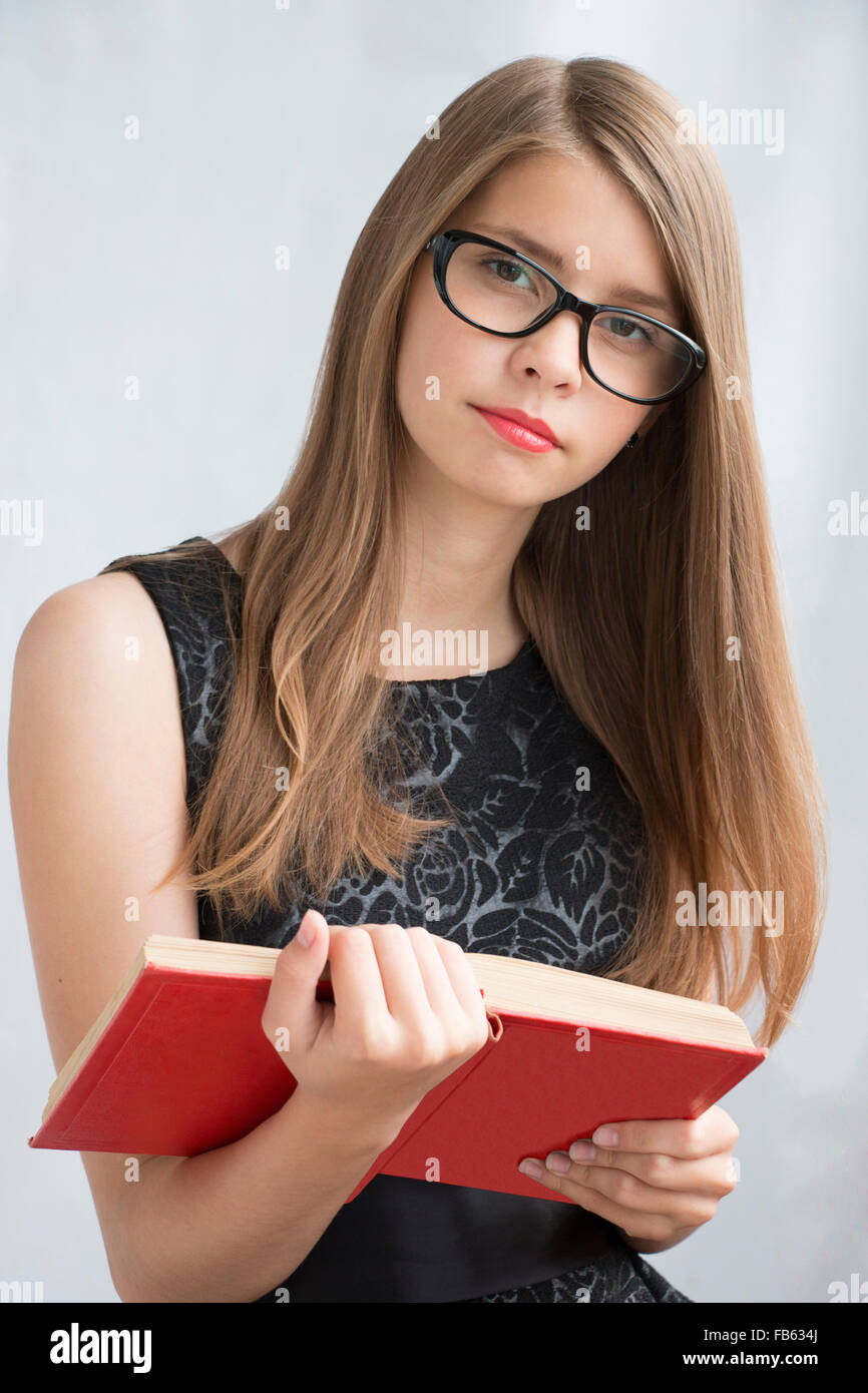 teenage-girl-in-glasses-with-books-FB634J.jpg