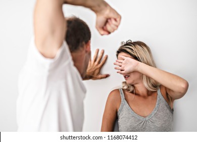 man-beating-helpless-woman-home-260nw-1168074412.jpg