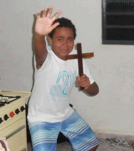 kid with cross Meme Generator