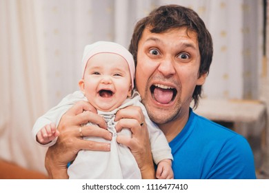 baby-on-hands-father-open-260nw-1116477410.jpg